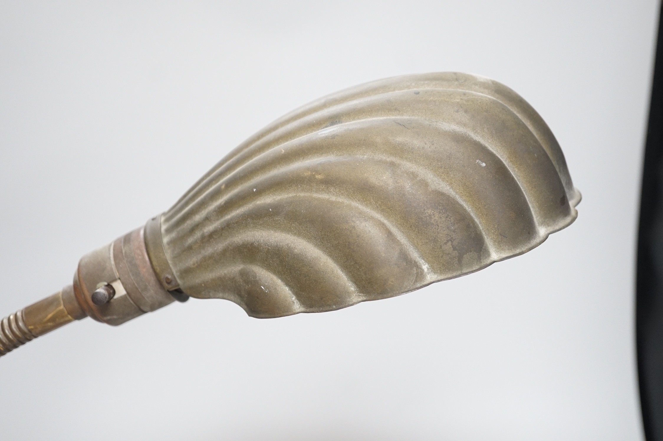 An Edwardian brass adjustable ‘shell’ desk lamp